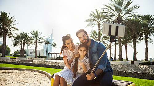 family taking a selfie in a park