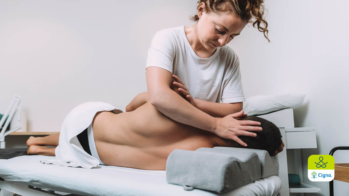 woman specialist practicing osteopathy with patient