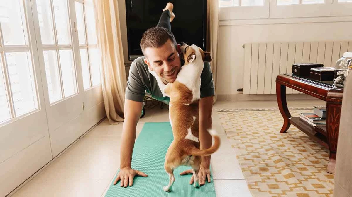 man exercising with his dog
